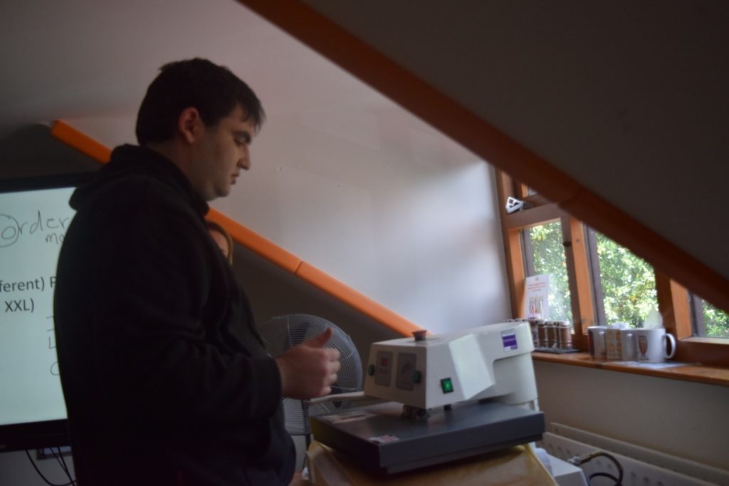 Male student printing an item