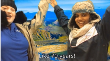 Student in front of green screen