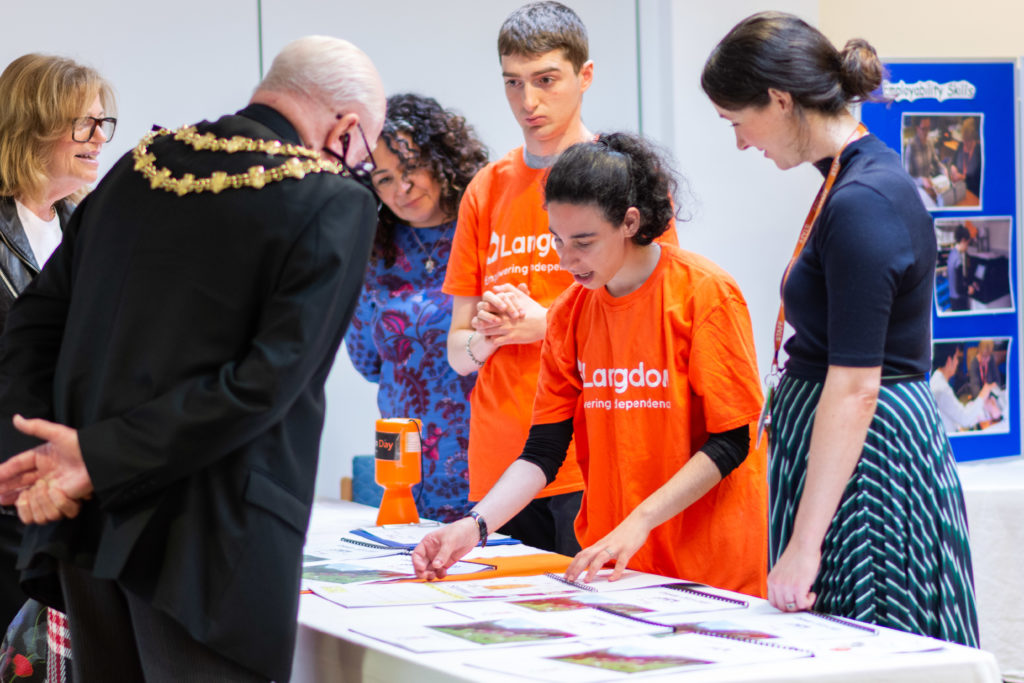 Langdon College student showing Trevor Holt, Mayor of Bury their work