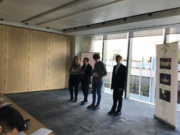 Learners giving a presentation about the products to the Dragons