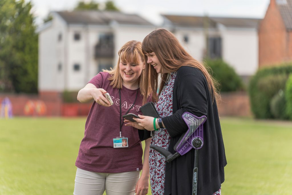 Student Finola showing Communications Lead Helen video clips from Sprots Day