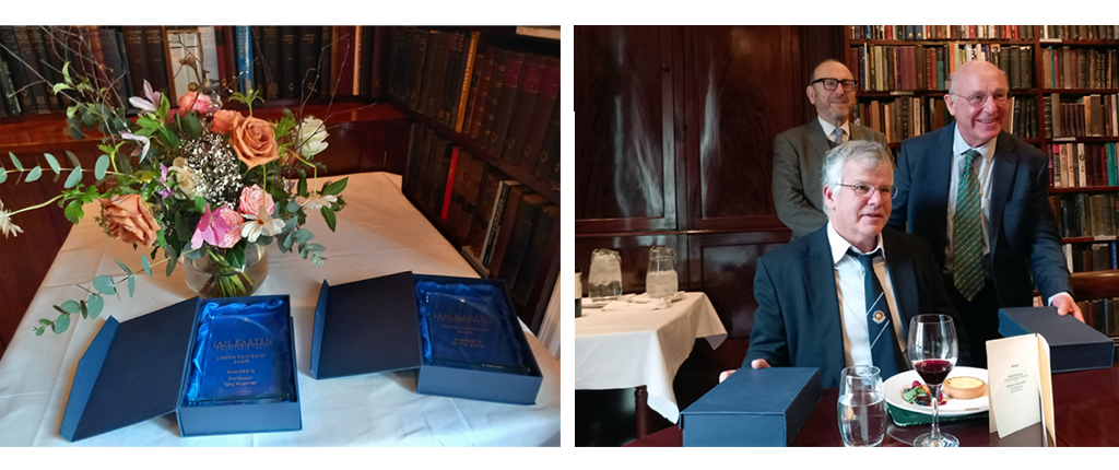 Pictured are the Lifetime Contribution Awards on a table with a vase of flowers next to them and Anthony Davis, Chair of the Ian Karten Trust with Tim and Tony receiving the awards.