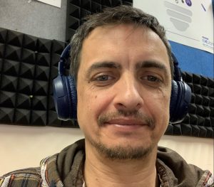 A photo of Max Bianconi wearing headphones as he takes part in a Microsoft Teams call