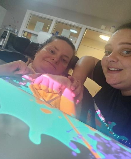 Laura, one of the support workers at Pamela Barnet, with Bry in the Sensory Space 