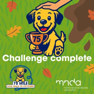 Illustration of a cheerful yellow dog holding a trophy marked “75” with a hand patting its head. The background shows green grass and autumn leaves. Text reads “Challenge complete” with logos for the “75 Mile Dog Walk in October” and the Motor Neurone Disease Association.